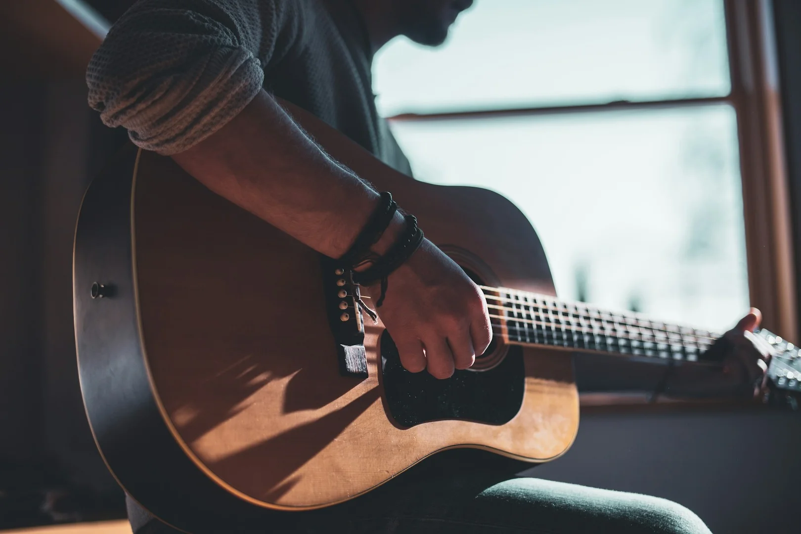 Luthier crafting a handmade guitar at Turtle Lake Instruments